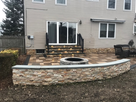 Back yard fire pit and wall of NJ